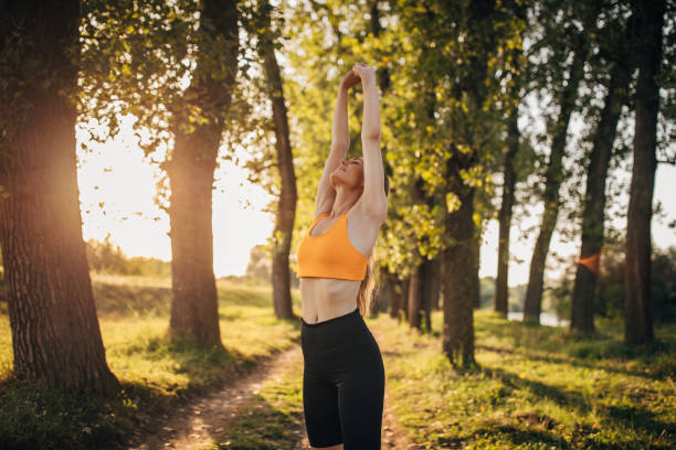 istock Fit woman exercising alone in nature 1295981862