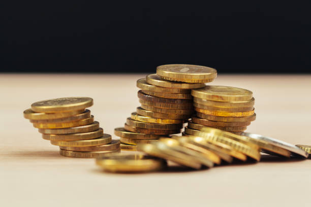 istock piles of coins on working table 1295982722