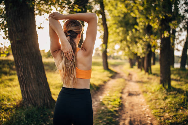istock Fit woman exercising alone in nature 1295982964