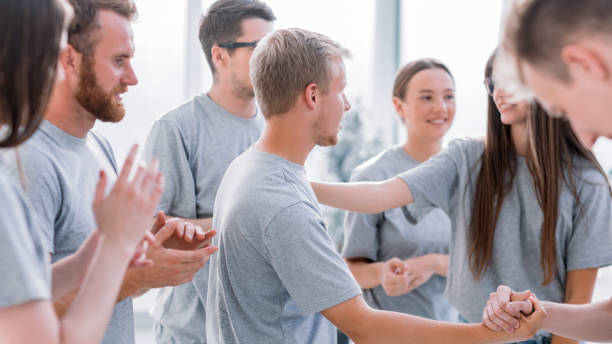istock group of cheerful students applauding rivals during the training 1295983012