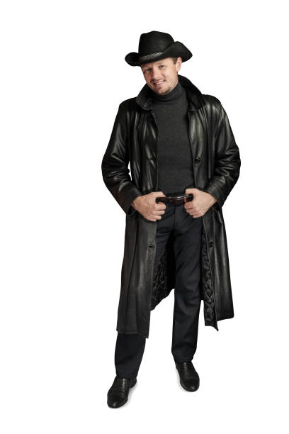 istock Smiling man with hands on his belt and wearing a hat. 1295983177