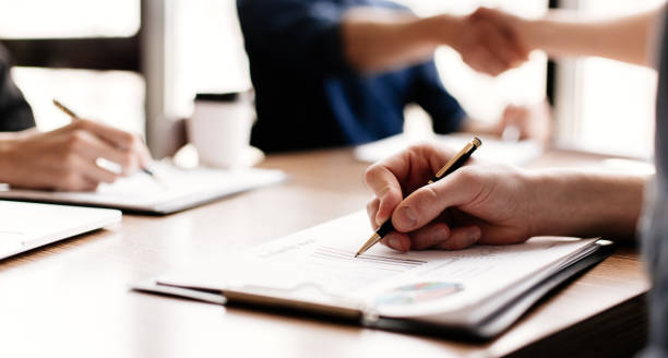 istock close up. business colleagues work with financial documents 1295983189