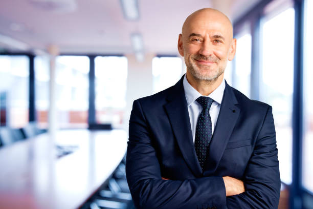 istock Executive senior businessman standing in the office 1295983209