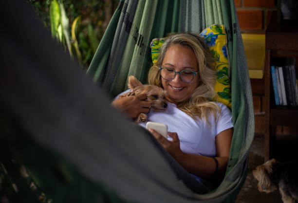 istock Young woman makes plays with dog 1295983343