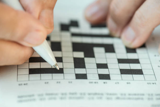 istock Senior Woman Doing Crossword Puzzle 1295984452