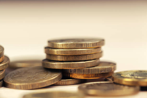 istock piles of coins on working table 1295985363