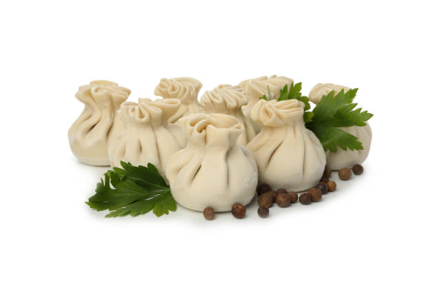 istock Raw khinkali, pepper and parsley isolated on white background 1295986683