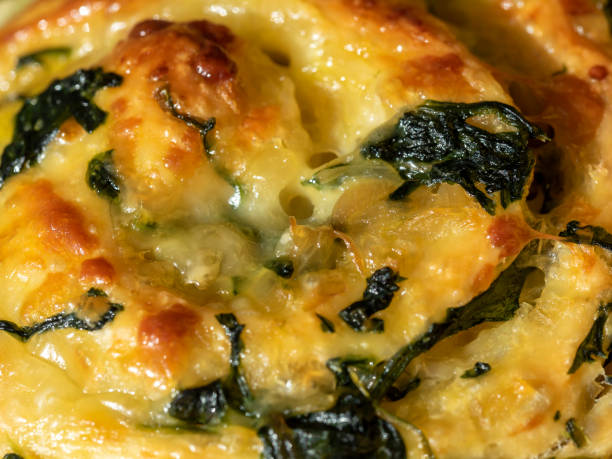 close-up of baking texture with cheese and spinach.