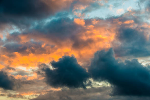 istock Panoramic view of pink clouds in sunset sky 1295987293