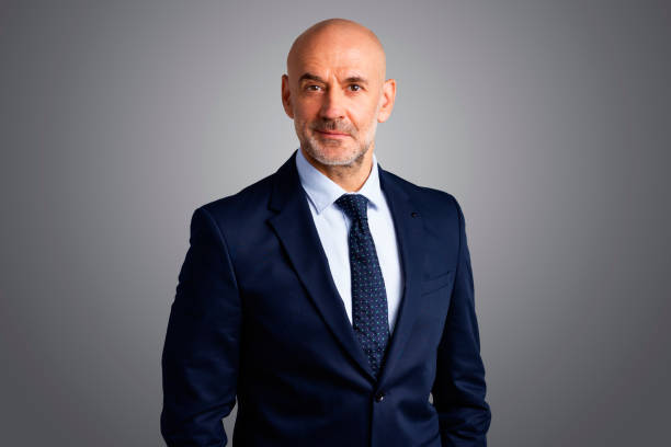istock Executive senior businessman studio portrait 1295988140