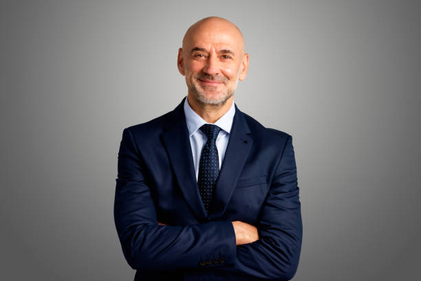 istock Executive senior businessman studio portrait 1295988141