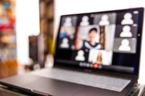Device screen with a woman hosting a video conference.