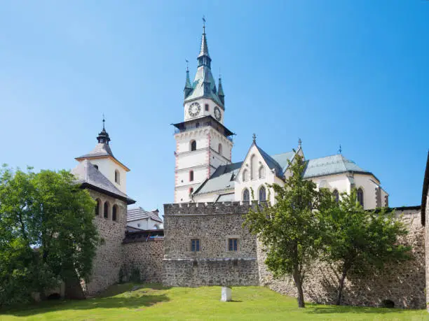 Kremnica  - The Safarikovo square with fountain and St. Catherine church.