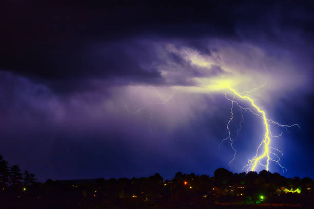 istock Lightning makes a dramatic display at night as it strikes low hills in a suburb 1295988968