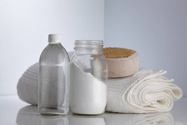 istock white vinegar and baking soda with scrub sponge and white towel 1295989259