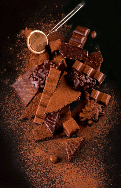 istock chocolate pieces and cocoa powder on wooden background 1295990813