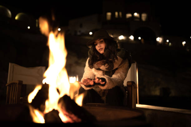 istock Sitting By The Fire At Night 1295991525