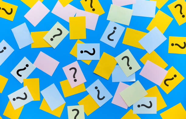 istock Question mark answer concepts with sign on colorful notepaper 1295992169