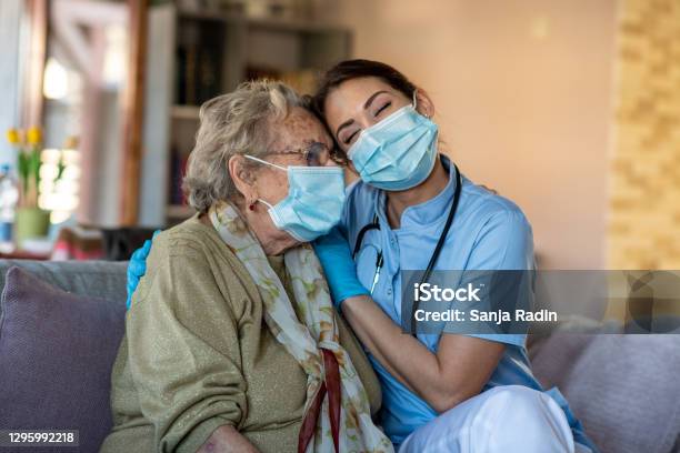 Nurse Is Hugging Granny Helping Her To Get Over Covid19 Crisis Stock Photo - Download Image Now