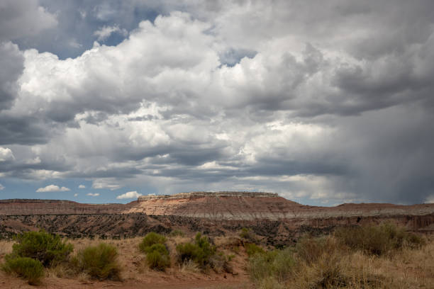 istock Rain Clouds Hang Over Desert Plateau 1295993166