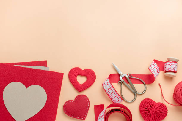istock Workplace for making handmade decorations for Valentine's Day. Top view with free space for text. 1295993730