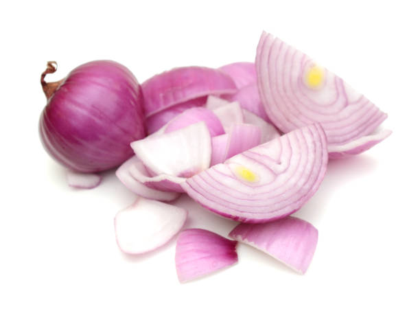 istock Raw red onion cutting on white background 1295996220