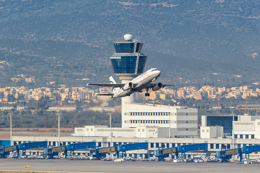 Lisbon, Portugal - November 04, 2022: Looking to airport area in Lisbon. The plane in front is just being prepared for take off.