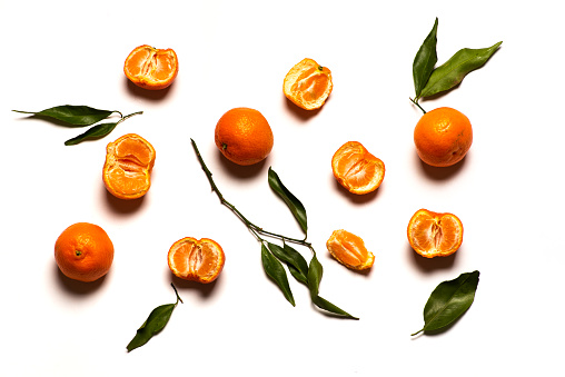 Tangerine orange fruit on on white background isolated flat lay top view Tangerine is a orange colored citrus fruit consisting of hybrids of mandarin orange with some pomelo contribution