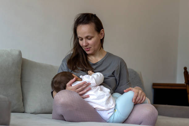 istock Young mother nursing daughter. 1296001006