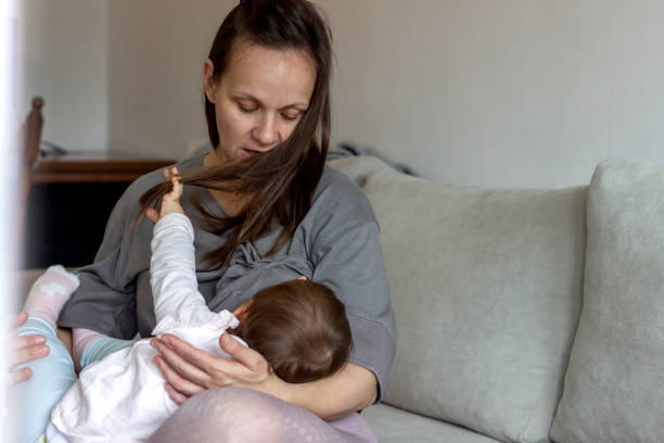 istock Young mother nursing daughter. 1296001841