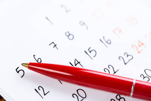 istock white calendar page for 2021 month schedule to make an appointment or manage the schedule every day with ballpoint pen for marks, for work planning and life concept 1296001900