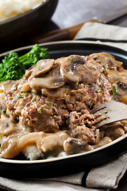 istock Salisbury Steak in a Rich Mushroom and Onion Gravy with Mashed Potatoes 1296002567