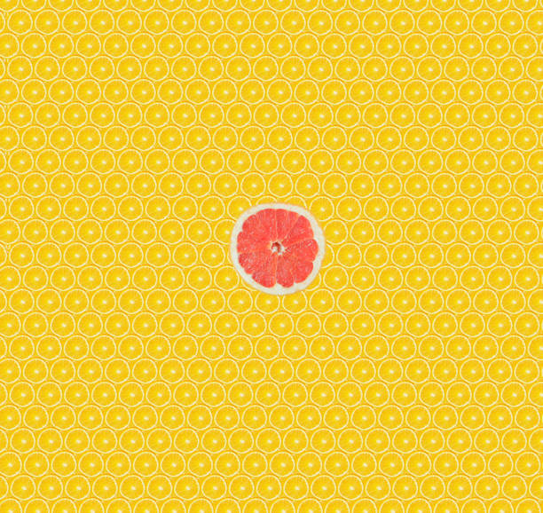 Texture of yellow orange segments with a grapefruit slice. Healthy lifestyle