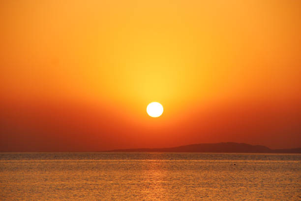 istock Sunset above sea. Beautiful summer decline above ocean 1296002703