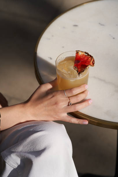 istock Bee gross cocktail with pineapple slice and whipped cream 1296003344