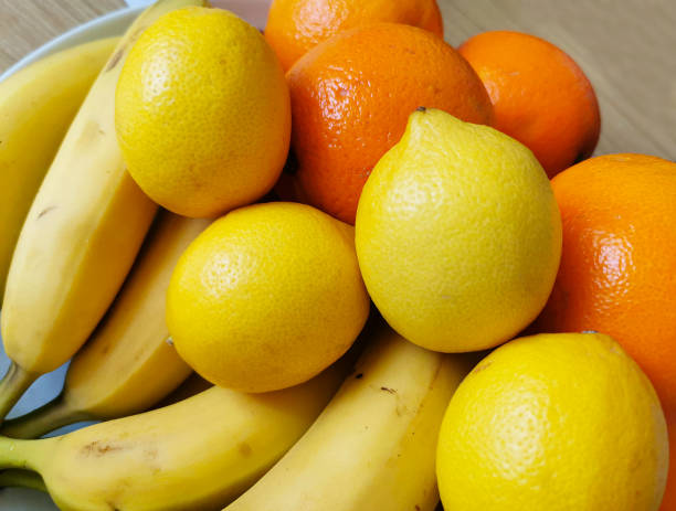 istock A colorful composition of fresh fruit arranged on a wooden table 1296006344