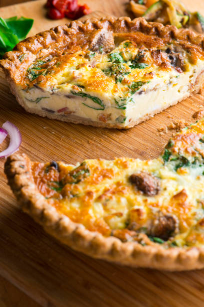 istock Quiche. Farm fresh eggs mixed with spinach, bacon, ham, sausage, cheese, vegetables poured in a pie crust and baked. Classic American restaurant or French Bistro breakfast or brunch favorite. 1296006400
