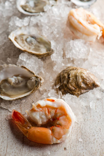 Oysters. Oysters on the half shell. Fresh oysters served with garlic, shallots, cocktail sauce, mignonette sauce and fresh lemons and limes. Classic American steakhouse or French bistro appetizer.