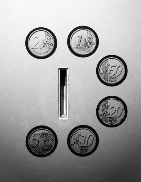 euro coin slot in black and white
