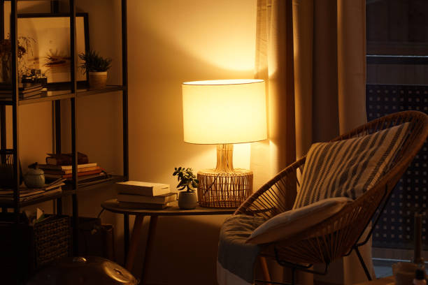 istock View of a cozy reader's corner with a table lamp spending warm light 1296013609