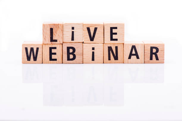 istock Live webinar text arranged from wooden letters on white background. 1296013734