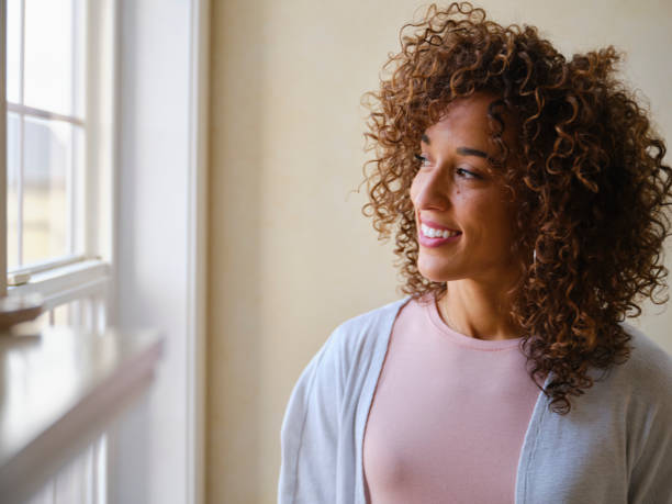 istock Smiling Woman in a Home 1296014223