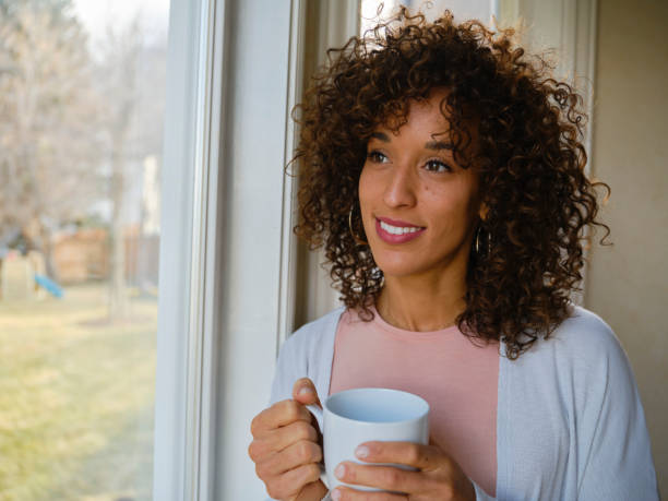 istock Smiling Woman in a Home 1296014756