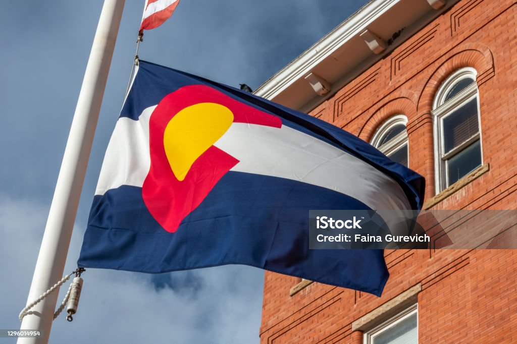 Colorado Flag in front of the building Colorado Flag in front of the building in Central City, Colorado Colorado Stock Photo