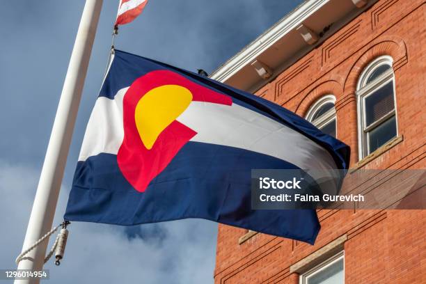 Colorado Flag In Front Of The Building Stock Photo - Download Image Now - Colorado, State Capitol Building, House