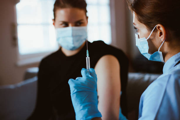 istock Young woman vaccinated. COVID-19 vaccination. 1296015372