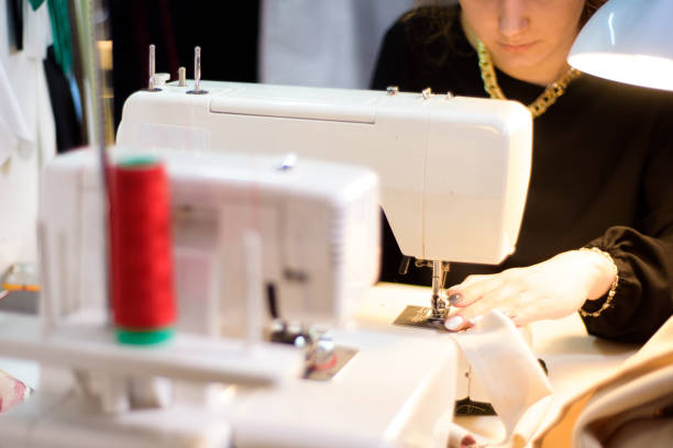 istock Process of working with sewing machine in an atelier. 1296018709