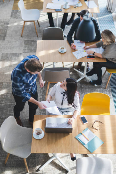 istock Overhead view of people working in a bar 1296020234