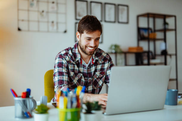 istock Project manager working from home on laptop during coronavirus pandemic lockdown 1296021441