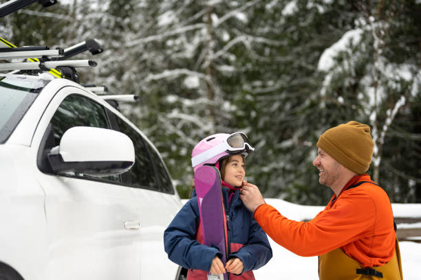 istock Father and daughter on a ski vacation 1296021989